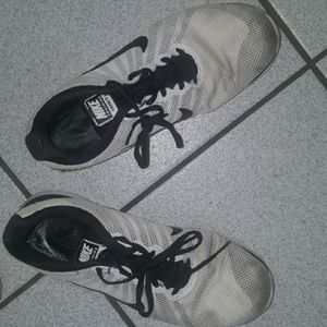 White NIKE running shoes